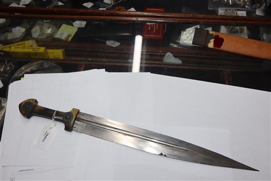 An Eastern dagger with leaf-shaped fullered blade, horn grip set metal bosses and wooden scabbard (a.f) L.50cm